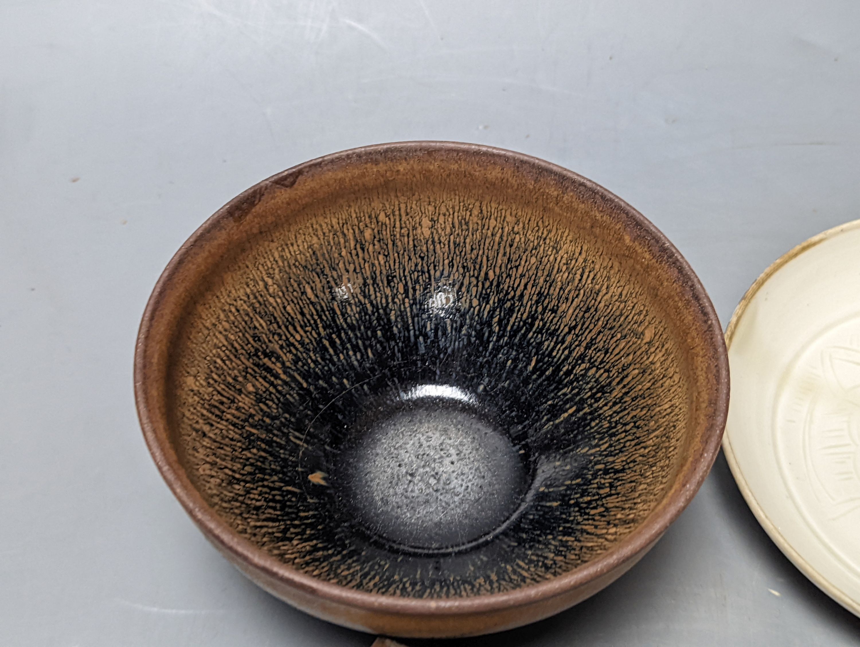 Two Chinese hare’s fur bowls and a Qingbai style dish, 13cm